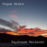 Photo of a orange-hued mountain sunrise, with the band name (Fugue State) printed in the upper left, and the album title (Daydream Believer) printed in the lower right. The font used for both of these resembles an old typewriter, and the words are in white.